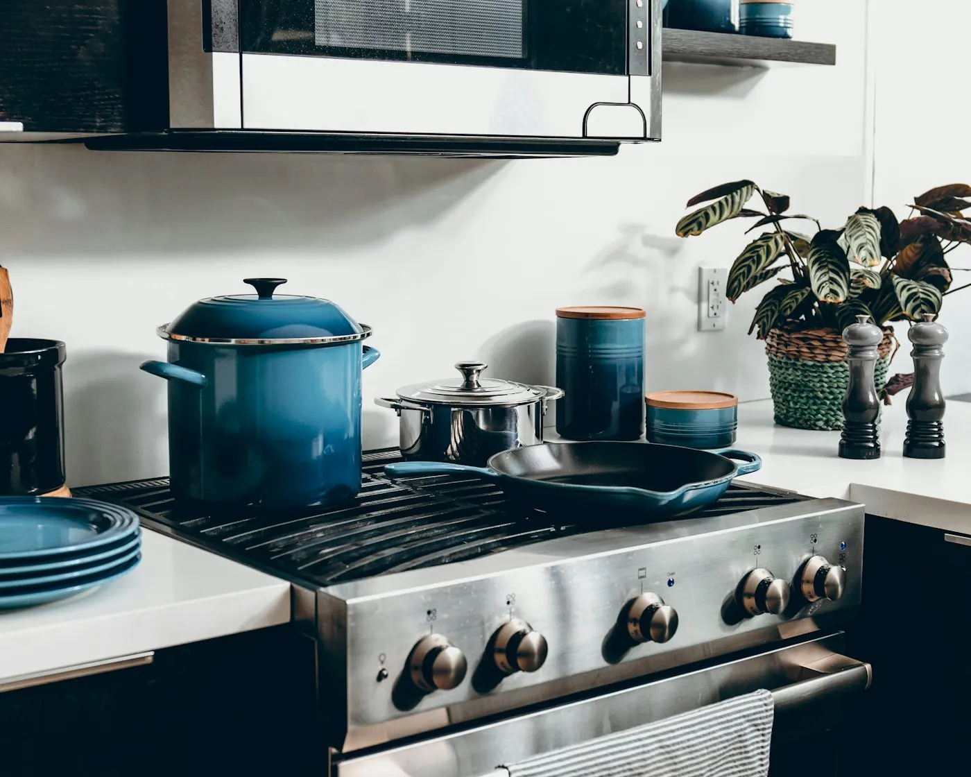 A stainless steel gas range in a kitchen